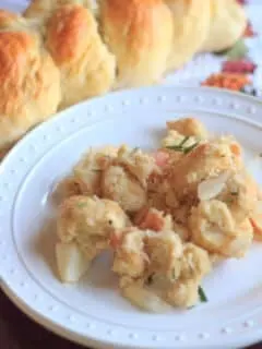 This vegetarian challah bread stuffing will be great at your Thanksgiving table. Cooked on the stovetop to save oven space, added apples for crunch, and garnished with fresh rosemary.