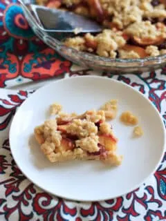 Cherry peach crumb bars - perfectly balanced with just the right amount of fruit and just the right amount of crust! | trialandeater.com