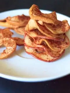 Cinnamon apple chips. No added sugar, no dehydrator required! Vegan, gluten-free, and healthy snack any time.