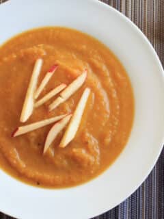 Butternut squash apple soup. Delicious autumn flavors blended together make this vegan soup a crowd-pleasing appetizer.