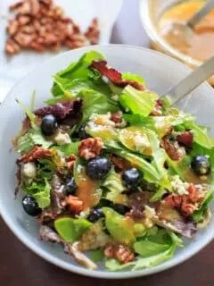 Italian Blue Salad - mixed greens served with blue cheese, honey roasted pecans, fresh blueberries and an apricot vinaigrette dressing.