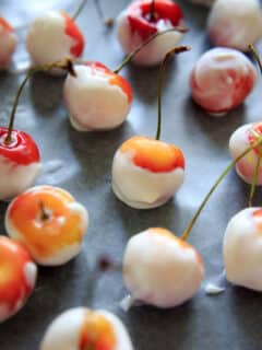 Greek Yogurt Covered Cherries are a refreshing and healthy frozen treat. You can get creative with toppings to make them extra festive!