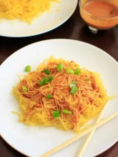 Spaghetti squash noodles and spicy peanut sauce make a delicious, gluten-free and vegan dinner that's easy to prepare!