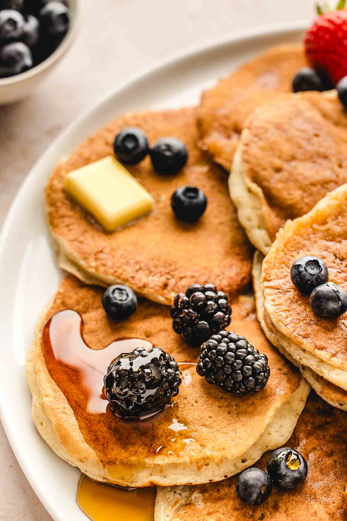 close up of buttermilk pancakes with fresh berries