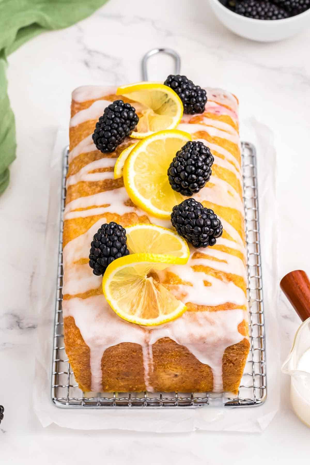 lemon blackberry bread with fresh lemon slices and lemon glaze