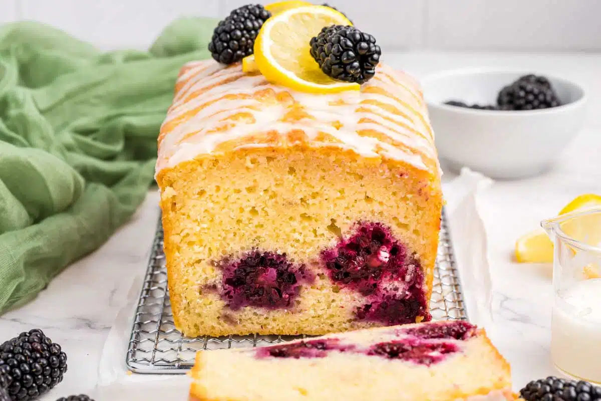 lemon blackberry bread with front piece sliced off