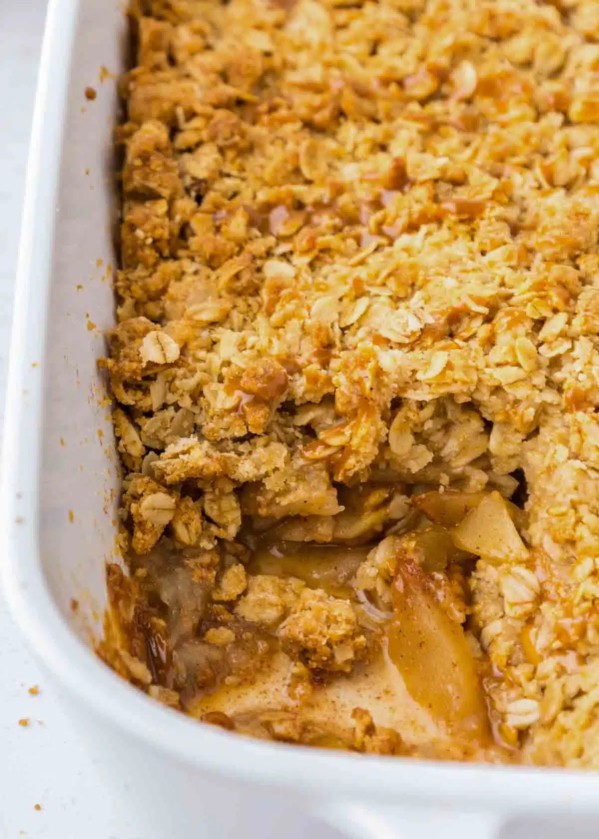 close up of caramel apple crisp with a piece taken out