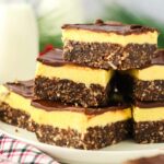 stack of Nanaimo Bars on white plate