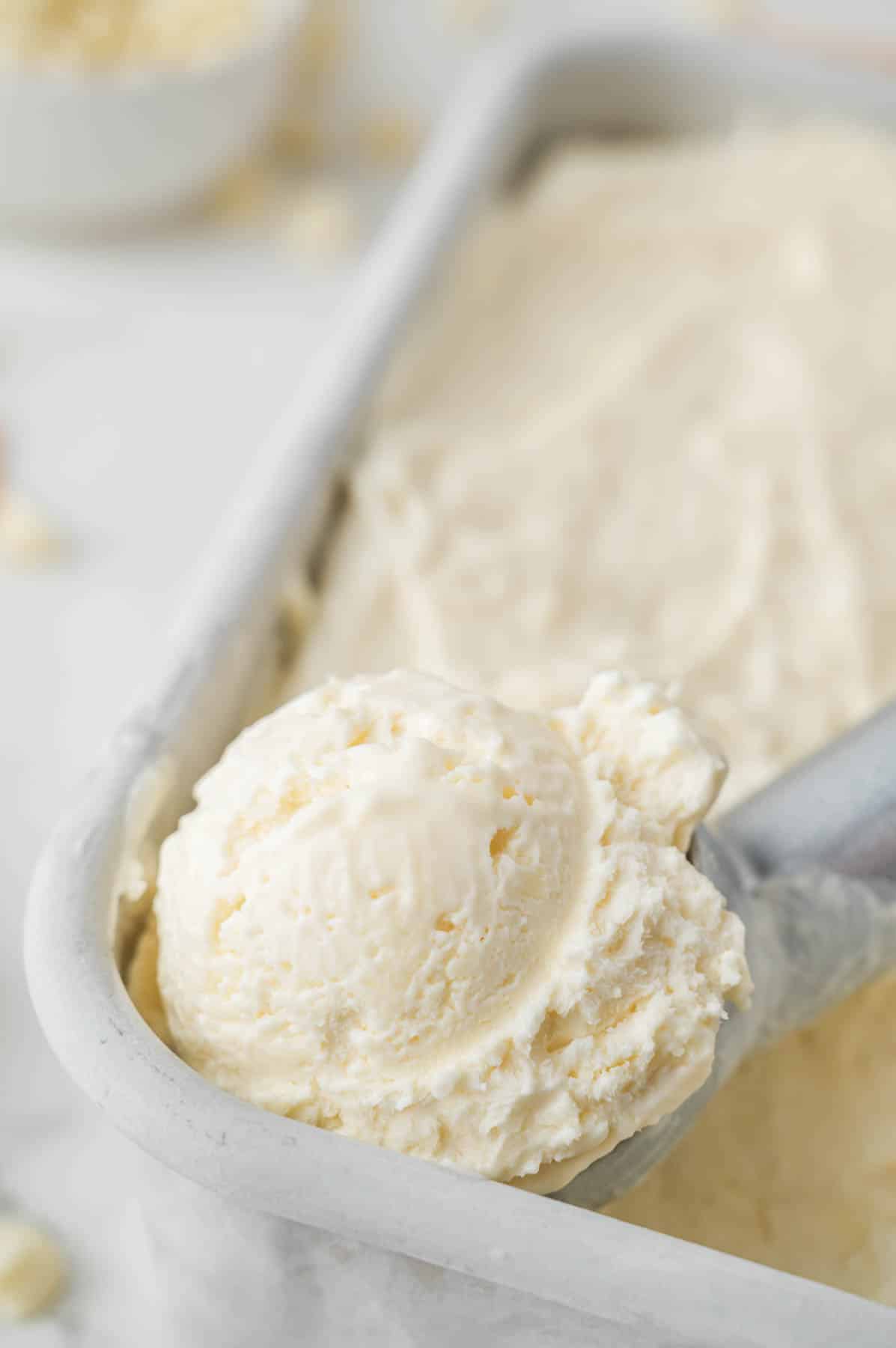 scooping white chocolate chip ice cream