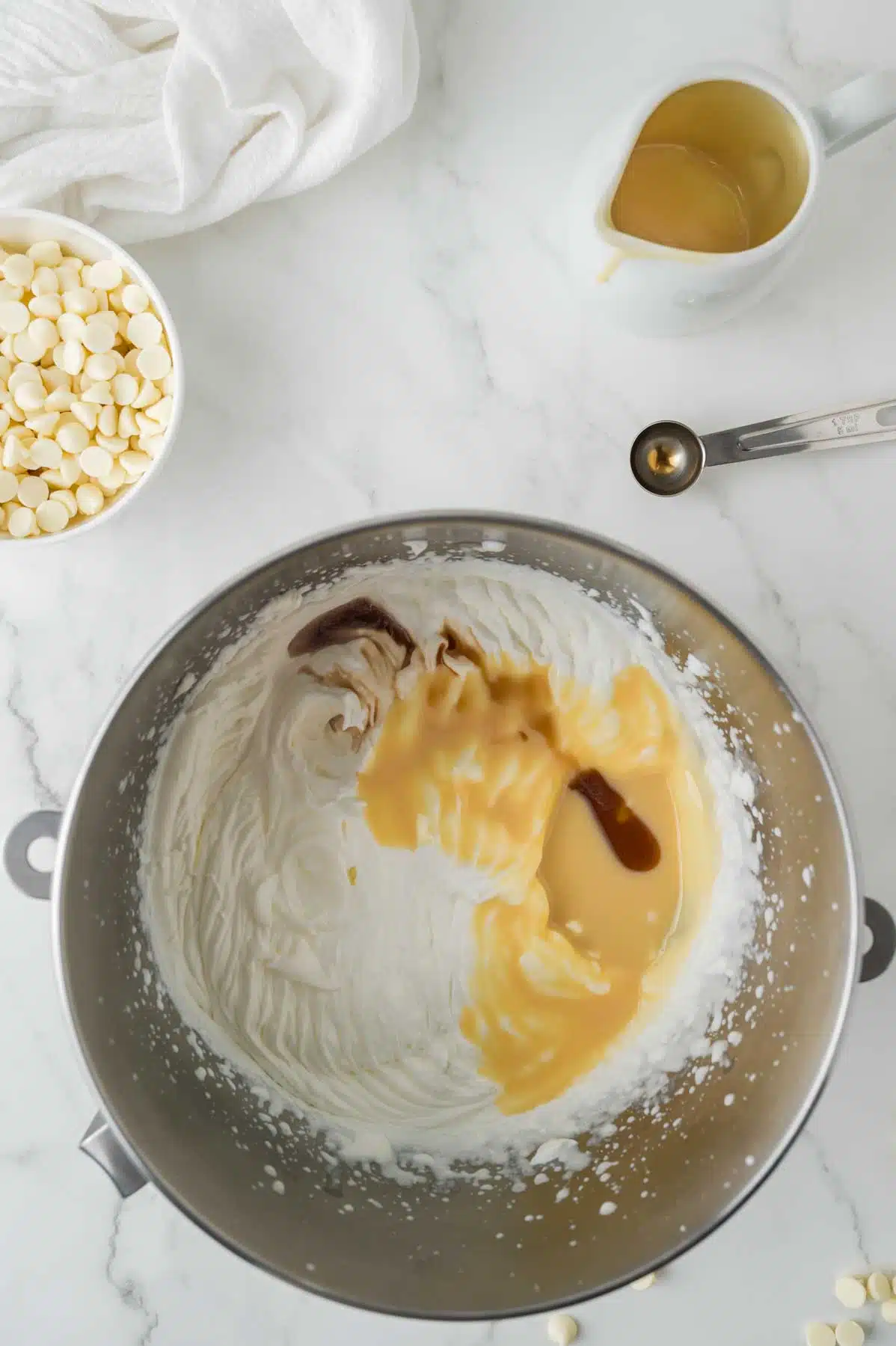 sweetened condensed milk, heavy cream and vanilla extract in a mixing bowl