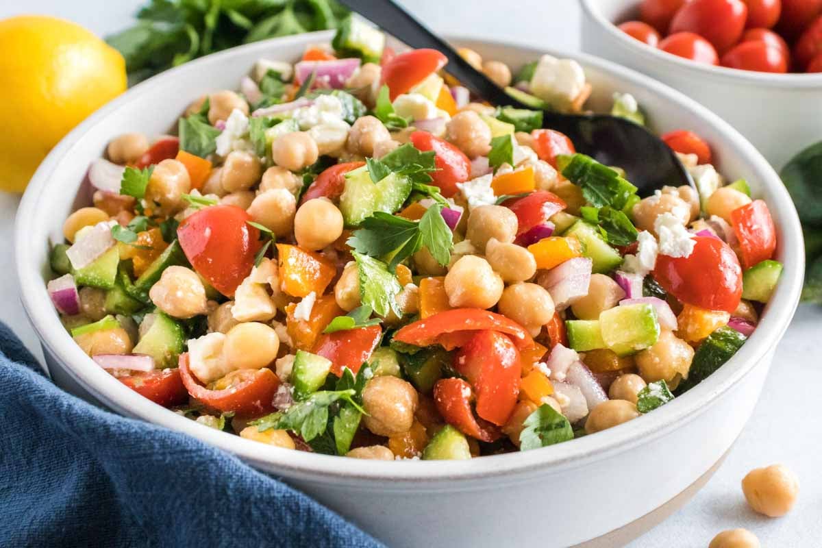 landscape picture of cucumber chickpea salad in a white bowl