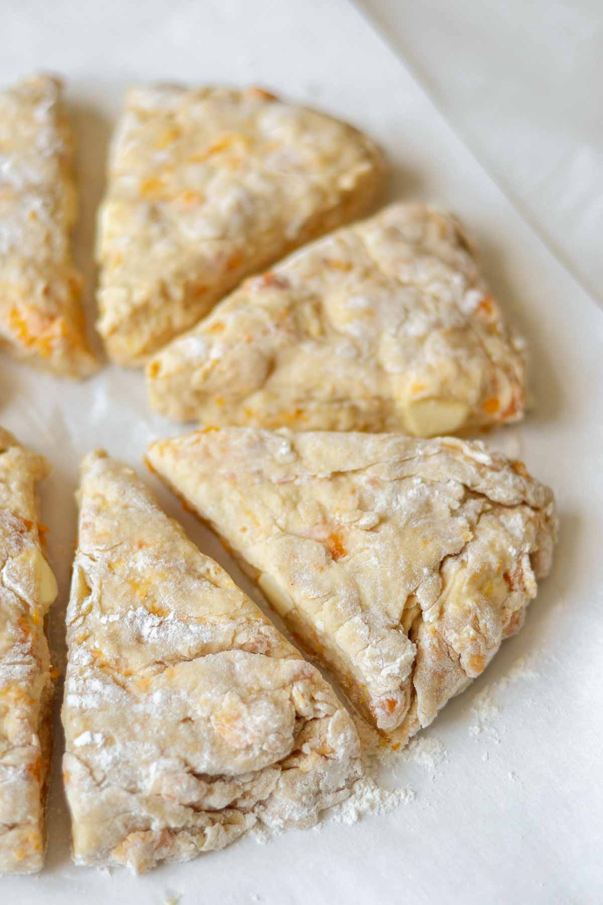 peach scone dough cut into triangles