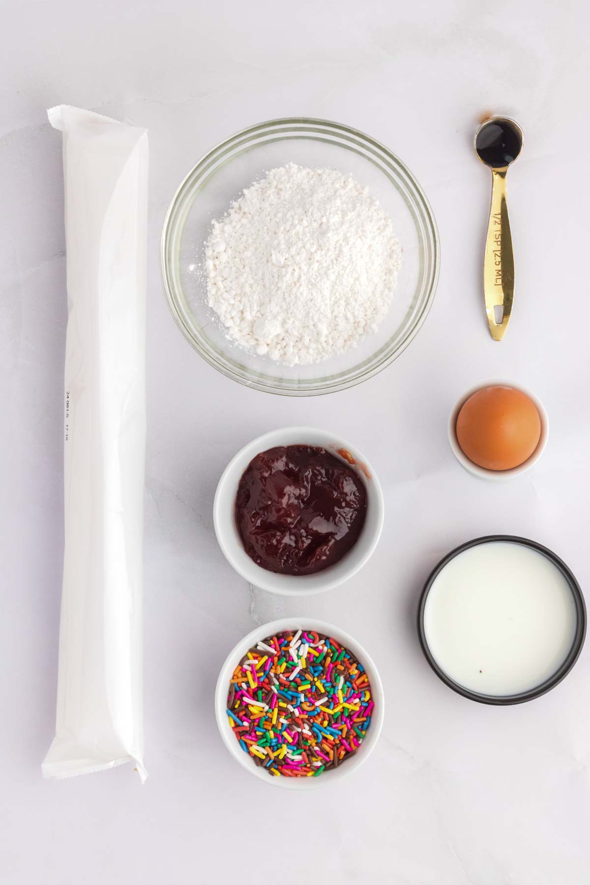 6 ingredients for homemade pop tarts in separate bowls on counter