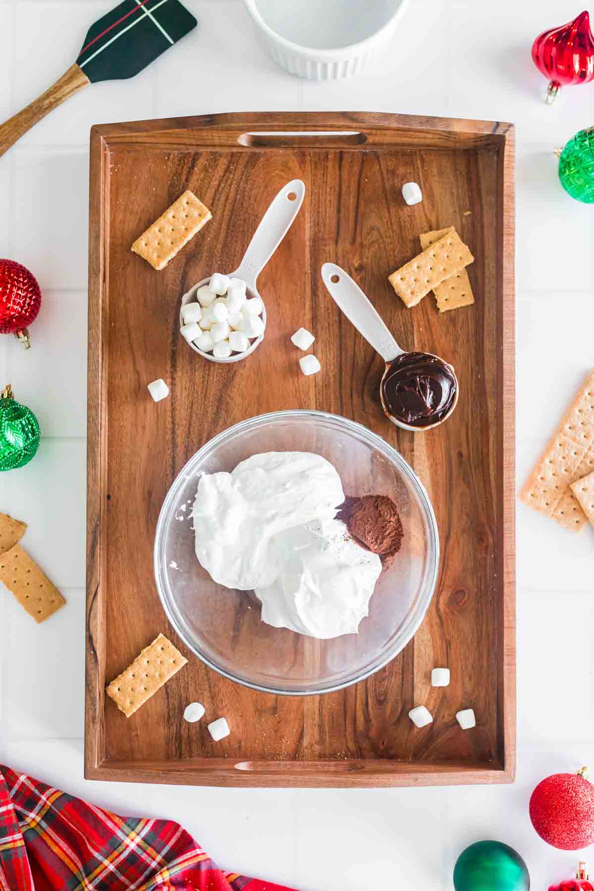 ingredients for hot chocolate dip on wooden tray