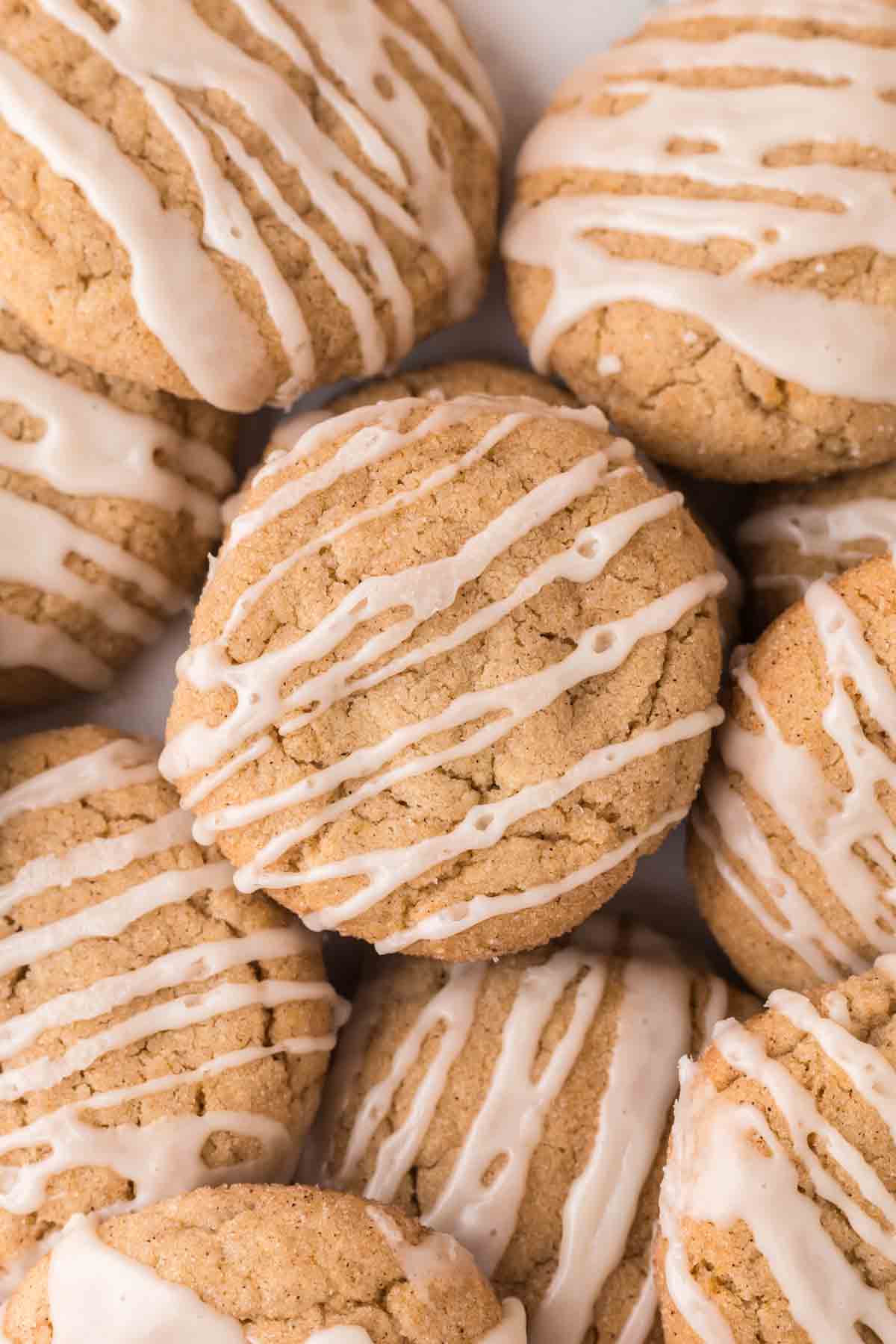 many iced apple cider cookies in a bunch.