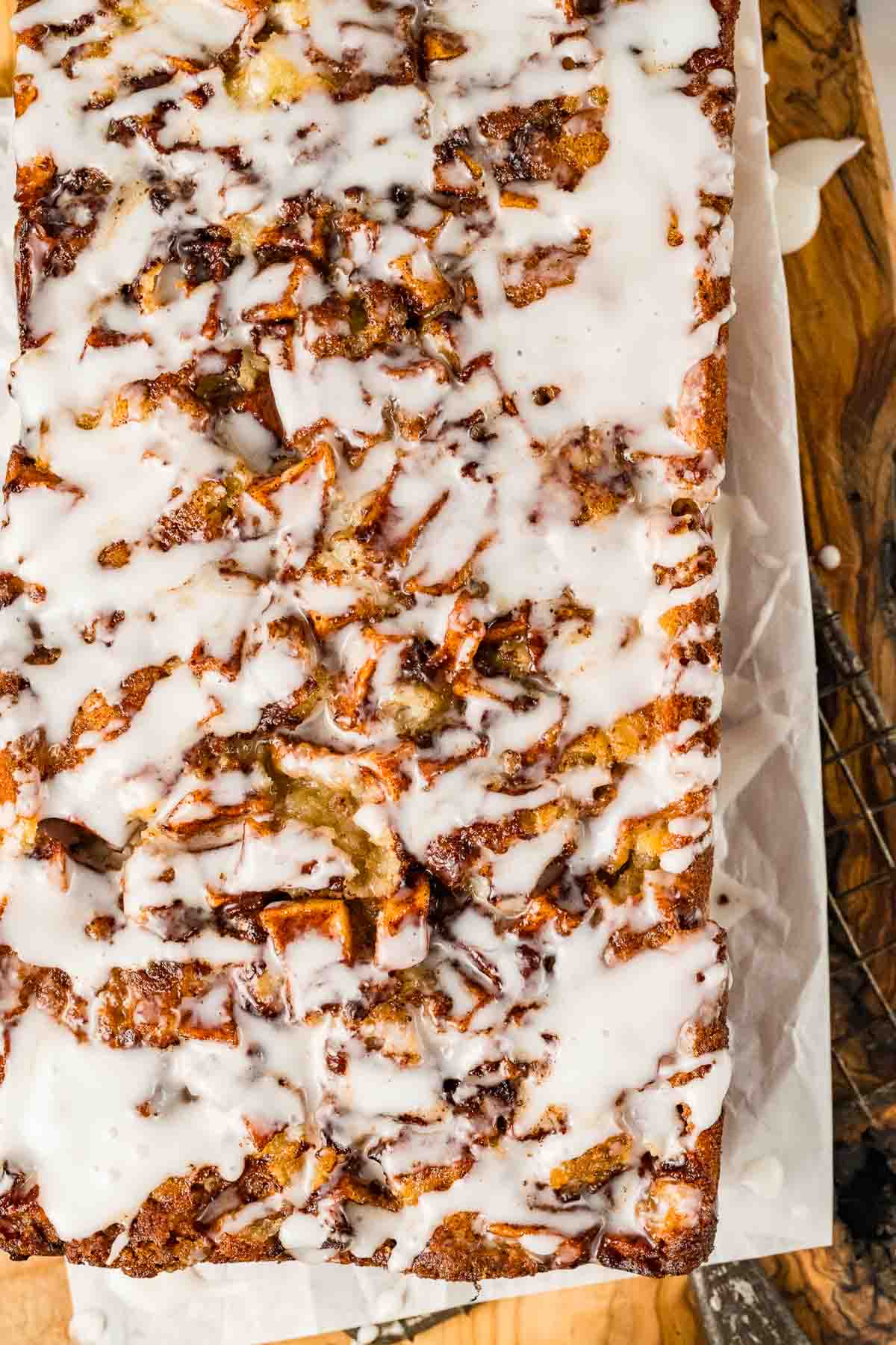 overhead picture of apple fritter bread drizzled in sweet vanilla glaze.