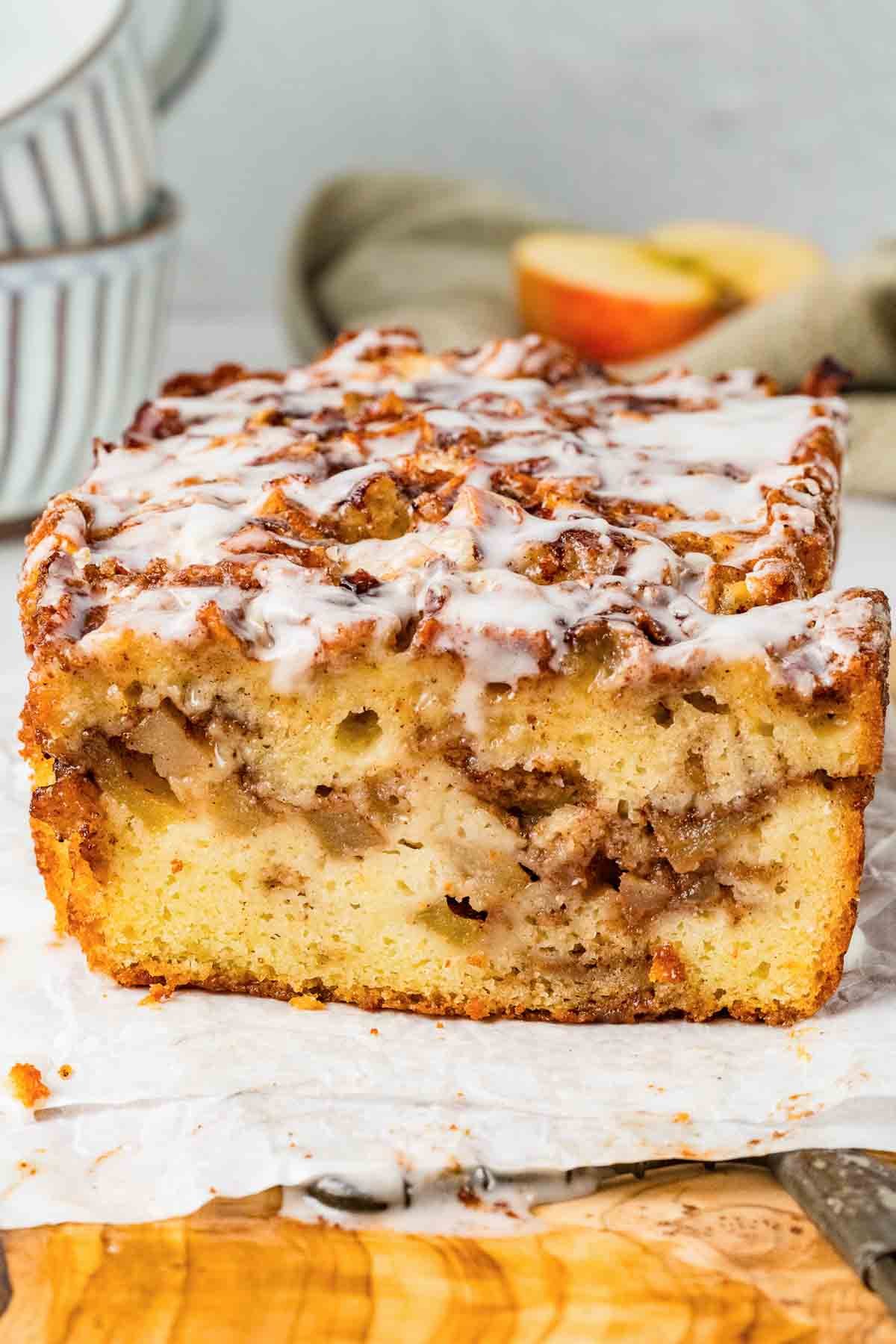 showing the inside of a cut slice of apple fritter bread.