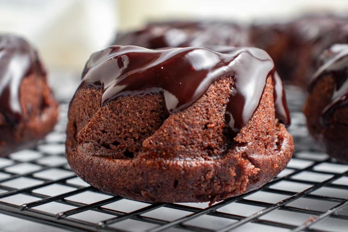 side angle view of mini chocolate bundt cake with chocolate ganache.