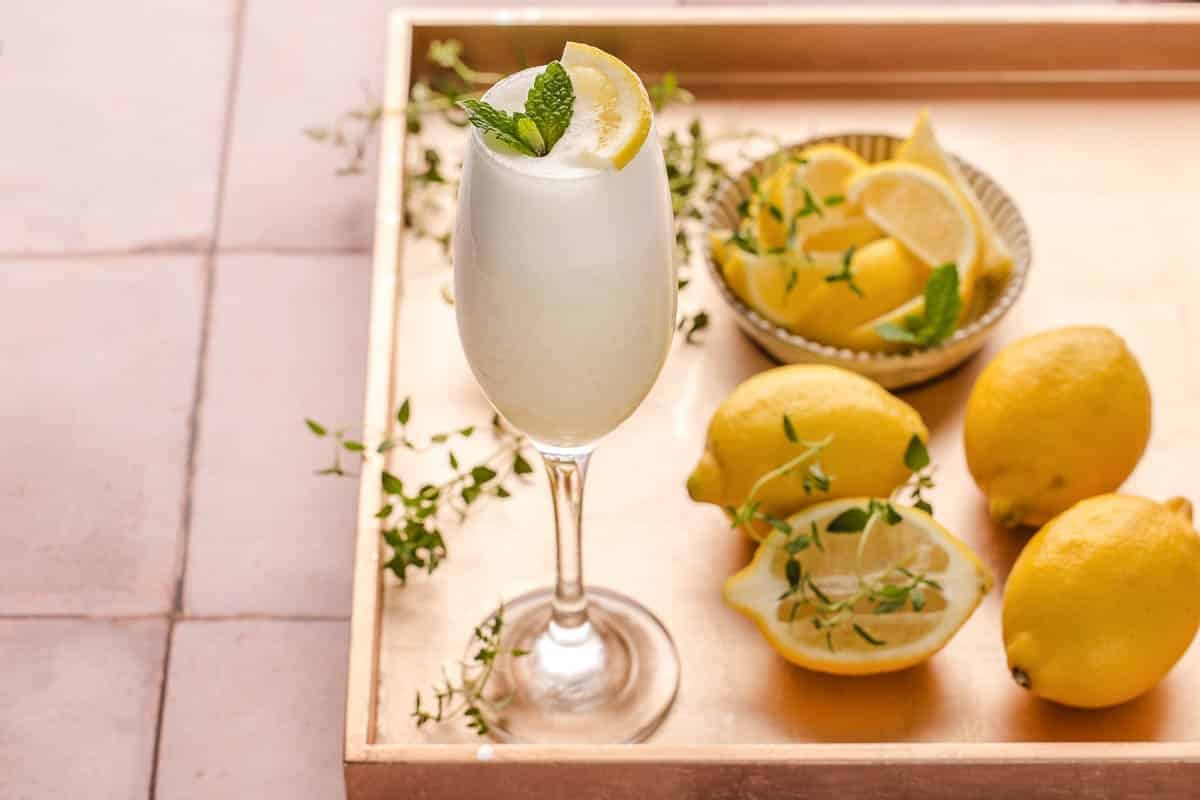 Lemon Sgroppino Cocktail on gold tray with lemons.