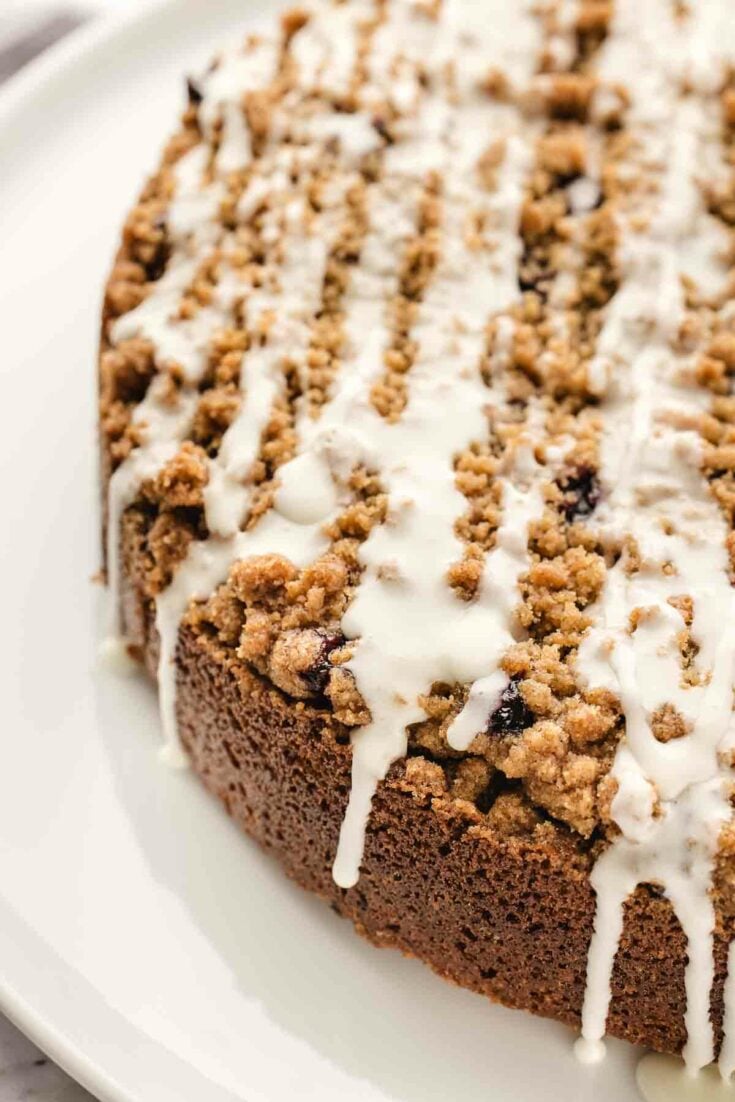 blueberry coffee cake drizzled with icing.